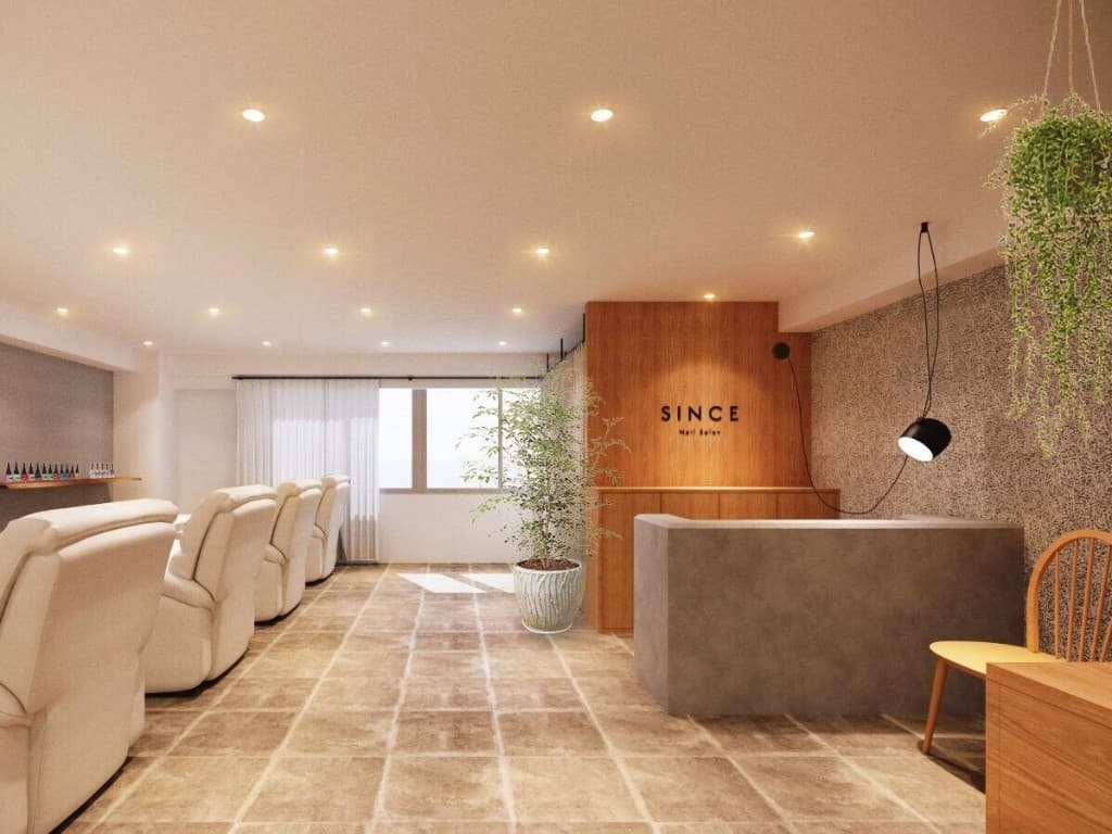 SINCE Nail Salonの店内。受付カウンターと施術チェアが並ぶ落ち着いた空間